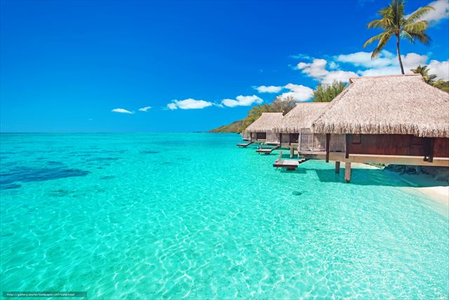 Villas on the green tropical beach with steps into water